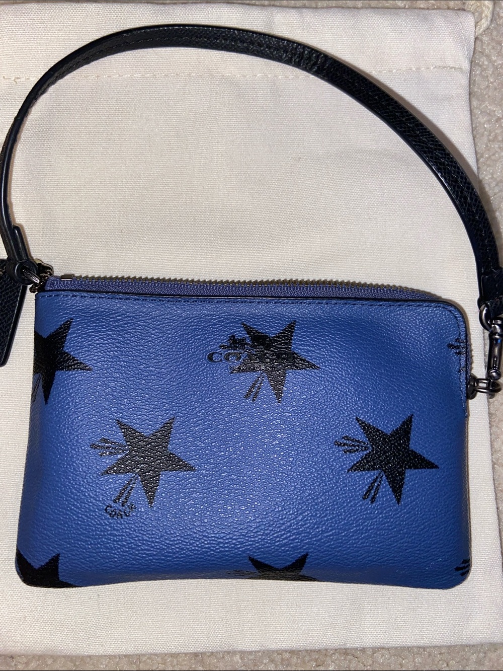 Coach Blue Leather Wristlet with Black Star Print